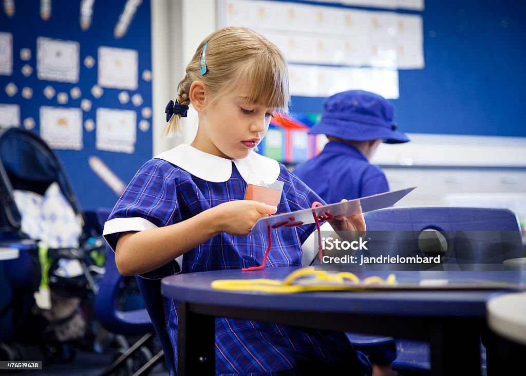 School girl at school doing an activity